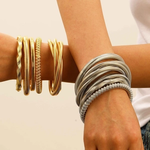 Exaggerated spiral spring bangle bracelets in gold and silver tones for women