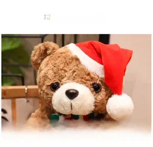 Detail of Christmas teddy bear with plush fur, red holiday hat, and knit scarf