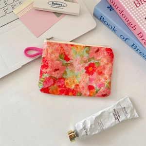 Detail of floral oil painting style mini organizer bag with zipper and pink handle