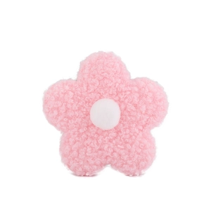 Close-up of a pink plush teddy fleece flower with a white center dot for DIY accessories
