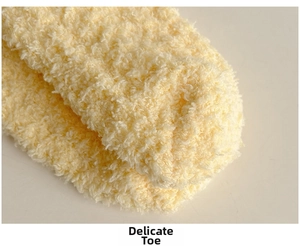 Macro detail of the high-density plush stitching and soft texture on pink coral fleece socks