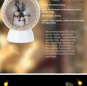 Detail view of snowman family inside a Christmas musical snow globe with golden accents