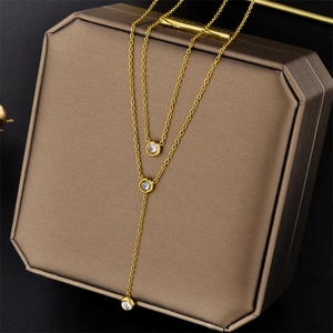Double-layered titanium steel necklace with three round zircon pendants on jewelry box