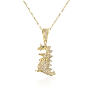 Close-up of 18K gold plated dinosaur pendant necklace with green and clear zircon stones