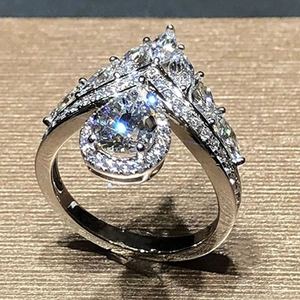 Elegant crown pear-cut zircon halo ring with V-shaped pavé band in silver plating
