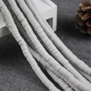 Close-up of 4mm grey polymer clay heishi beads strand for DIY jewelry making