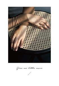 Close-up of five minimalist silver stacking rings worn on fingers with natural shadows