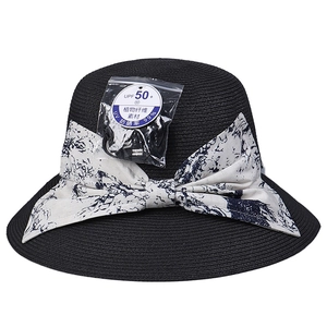 Elegant wide brim sun hat for women with a blue floral bow and UV protection fabric