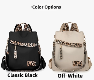 Detail view of Oxford fabric backpacks in black and beige with leopard print accents