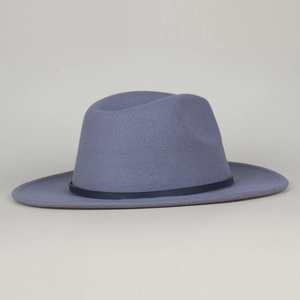 Close-up of felt fedora hat with wide brim and leather buckle detail in soft blue