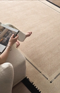 Close-up of French vintage rug featuring beige woven texture and geometric diamond pattern