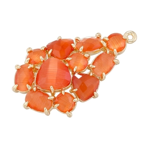 Detail of orange faceted crystals in grape leaf pendant with gold-plated metal base