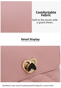 Detail of pink embroidered bucket bag with heart buckle and litchi texture leather