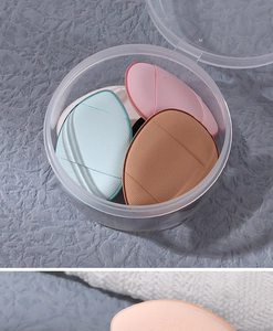 Detailed view of mini finger teardrop makeup puffs in a round transparent storage box