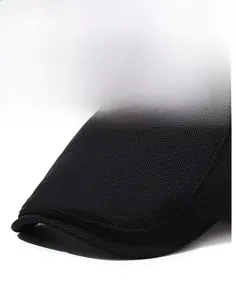 Detail of a black mesh beret cap showing the sturdy brim and textured fabric weave