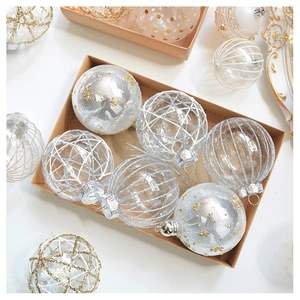 Detail of elegant champagne tulle and sparkling pearl polka dot Christmas tree ornaments