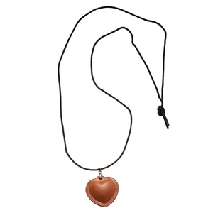 Vintage brown faux leather heart pendant necklace with woven cord for a minimalist look