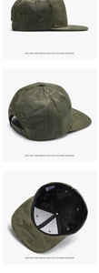 Detail view of military green camouflage baseball cap with adjustable strap and flat brim