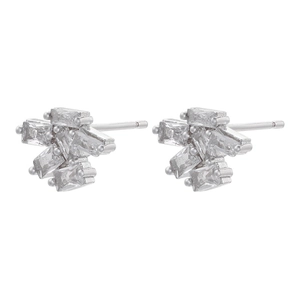 Macro shot of silver baguette-cut zircon cluster earrings with asymmetric geometric design