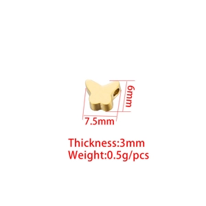 Golden butterfly charm in stainless steel with 7.5x6mm dimensions and 3mm thickness