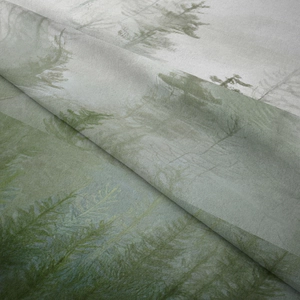 Close-up of bohemian forest tapestry fabric showing detailed pine tree print and texture