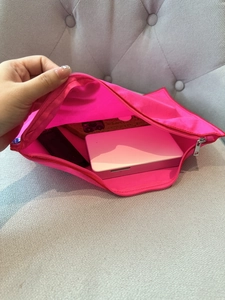 Detail view of nylon zipper organizer bag with inner compartments for phone and power bank
