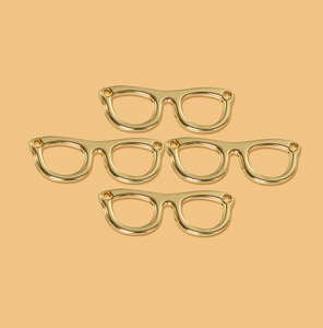 Set of four polished gold alloy glasses-shaped charms for DIY jewelry making and crafts