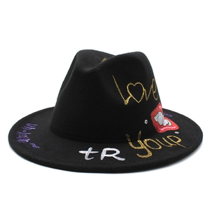 Black wool fedora hat with gold graffiti lettering and red lip print pattern