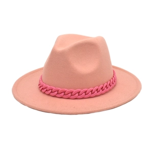 Detailed view of pink wool fedora hat with a bold decorative acrylic chain link accessory