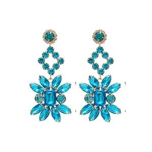 Boucles d'oreilles vintage en or avec fleurs losanges en cristal bleu et diamants sur blanc