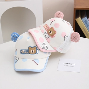 Close-up of kids mesh baseball cap with hello bear patch and polka dot pattern detail