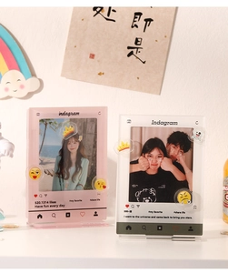 Close-up of Instagram style acrylic photo frames for mini cards on a warm desktop decor