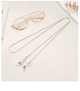 Detail of silver snake chain eyewear strap with non-slip silicone loops and metal clasp