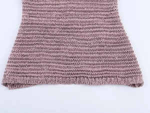Close-up of pink purple knit fabric texture and high-quality hem craftsmanship on top