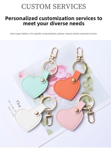 Detail of heart-shaped leather keychains in mint, orange, white and pink colors