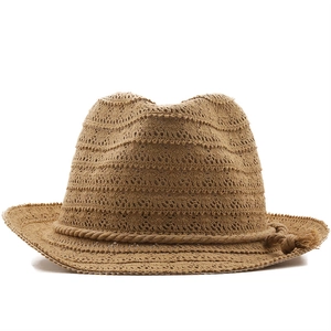 Handcrafted tan straw fedora hat with breathable crochet pattern and tassel rope band