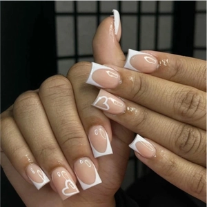 Classic French nude press-on nails with white heart line patterns and square tips