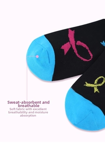 Close-up of black compression socks with blue toes and colorful ribbon patterns