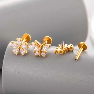 Golden stainless steel piercing set with zircon butterfly, flower and flat back studs