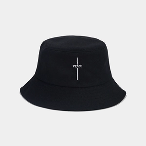 Close-up of PEACE embroidery on black cotton bucket hat with high-quality canvas texture