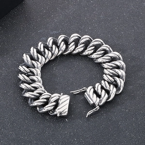 Vintage silver stainless steel Cuban link bracelet with twisted rope texture and double buckle