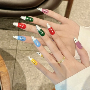 Extra-long almond press-on nails featuring creative multi-color sneaker canvas shoe designs