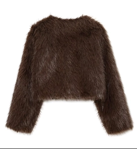 Detail view of the plush dark brown faux fur texture on this cropped fashion jacket