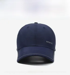 Front view of navy baseball cap with sports embroidery and reflective brim detail