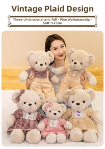 Detail view of plush teddy bears in vintage plaid outfits with soft textured fabric