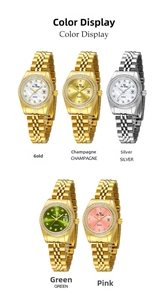 Close-up of mother of pearl watch dials with crystal markers and calendar date display
