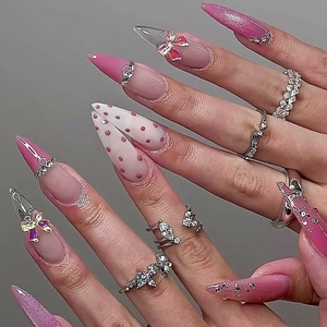 Pink French almond press-on nails with 3D bows, dots and glitter decorations