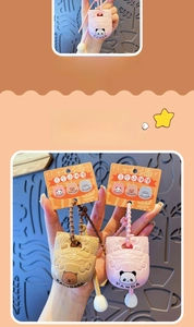 Close-up of cute Panda and Capybara stress relief zen wooden fish keychain with beads