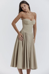 Detailed full-body shot of a khaki French vintage A-line midi sundress with slim straps