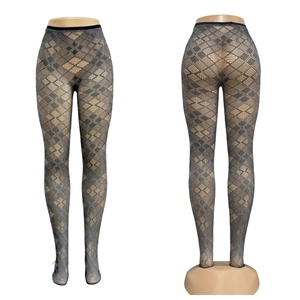Detailed pattern of dark gray argyle diamond mesh tights with semi-sheer fishnet texture